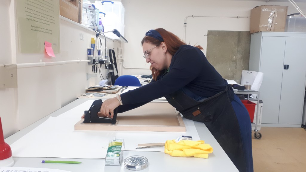 Sealing a frame after mounting prints into window mounts